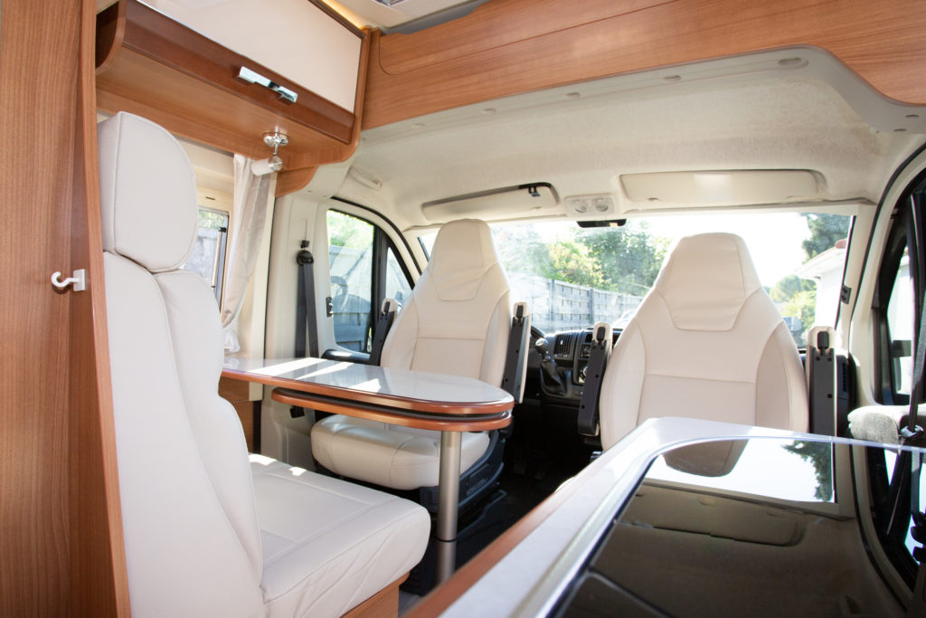 Interior of RV including chairs and table